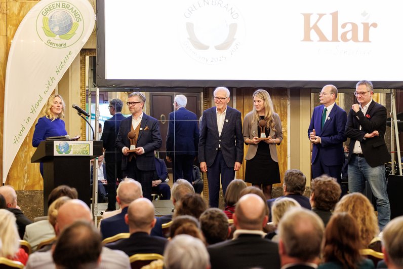 AlmaWin team accepts the 7th Green Brands Award on stage at the Green Brands Gala in Nuremberg